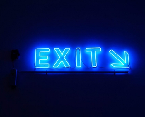 neon sign with text 'exit'